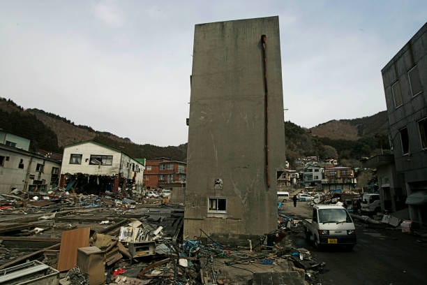 A View of debris and mud covered at Tsunami hit Destroyed mine town in Kamaishi on March 25, 2011, Japan.  On 11 March 2011, an earthquake hit Japan with a magnitude of 9.0, the biggest in the nation's recorded history and one of the five most powerful recorded ever around the world. Within an hour of the earthquake, towns which lined the shore were flattened by a massive tsunami, caused by the energy released by the earthquake. With waves of up to four or five metres high, they crashed through civilians homes, towns and fields.